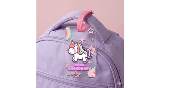 Personalized bag tag attached to a child’s school backpack for easy identification and safety.